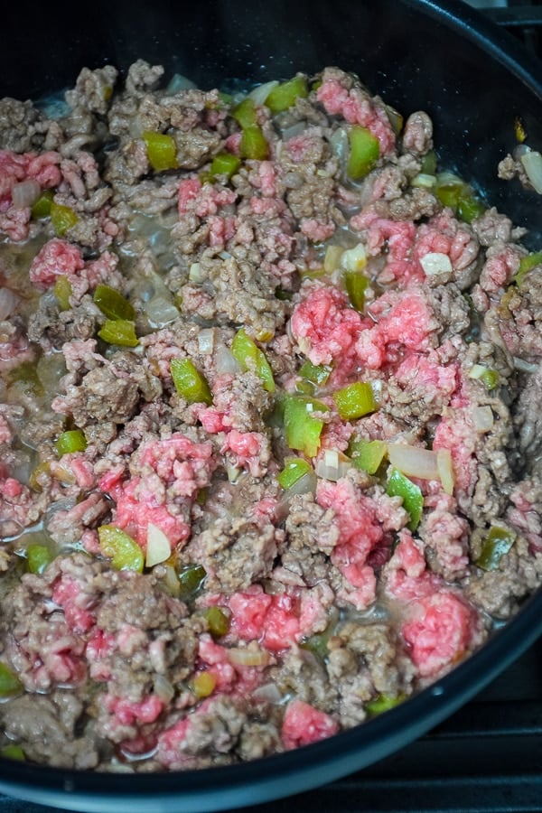 Lean ground beef browning in the skillet.