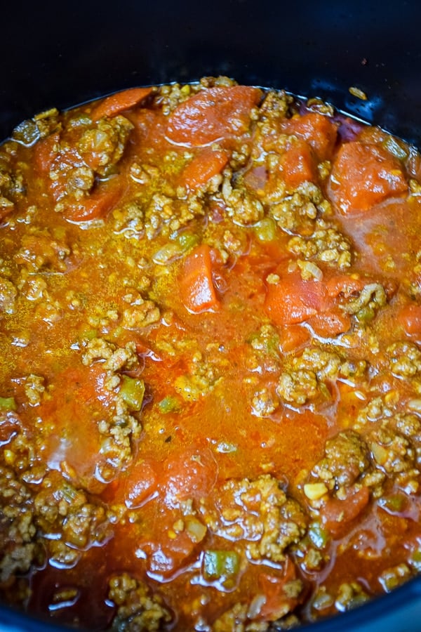 a pot of comfort food simmering: beef and tomato sauce base in a stock pot