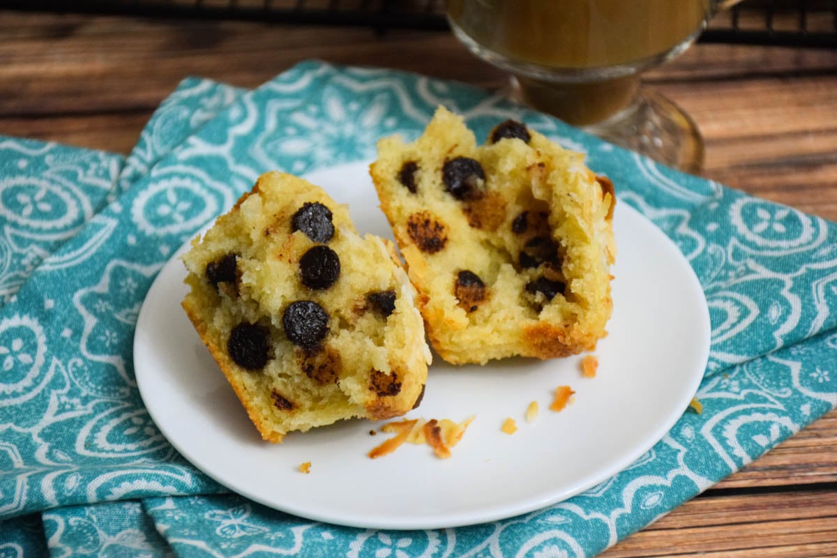 Coconut chocolate chip muffin split in half.