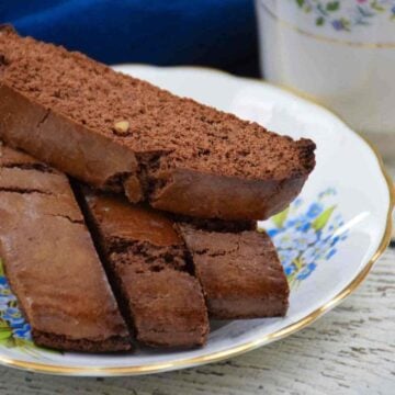 A stack of brownie biscotti on a blue floral plate.