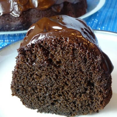 Upclose image of cake slice on a white plate.