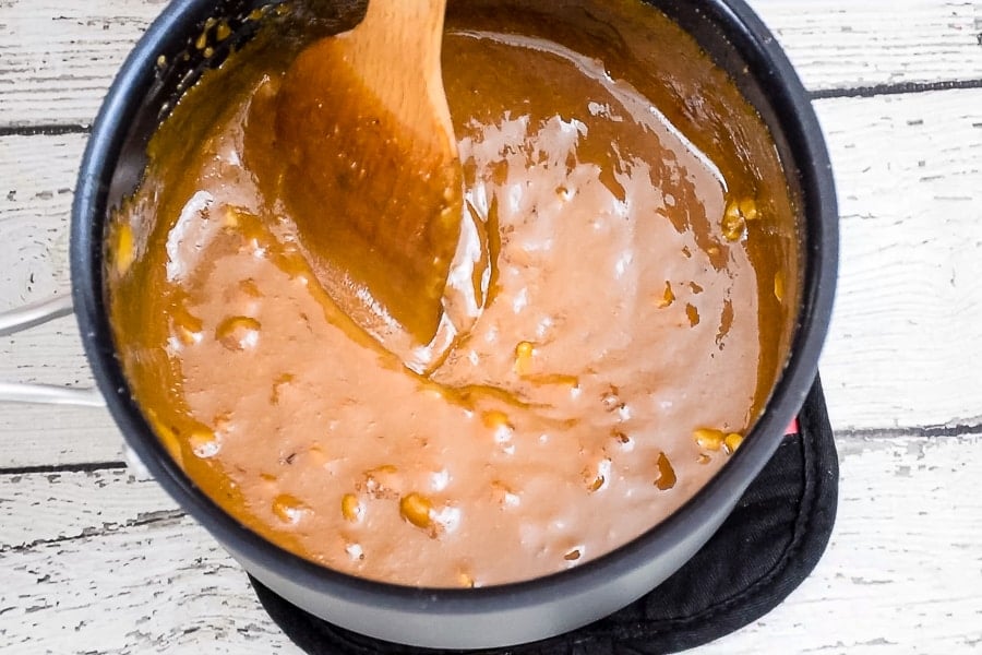 Stirring the brown sugar fudge - gloss is almost gone and ready to pour.