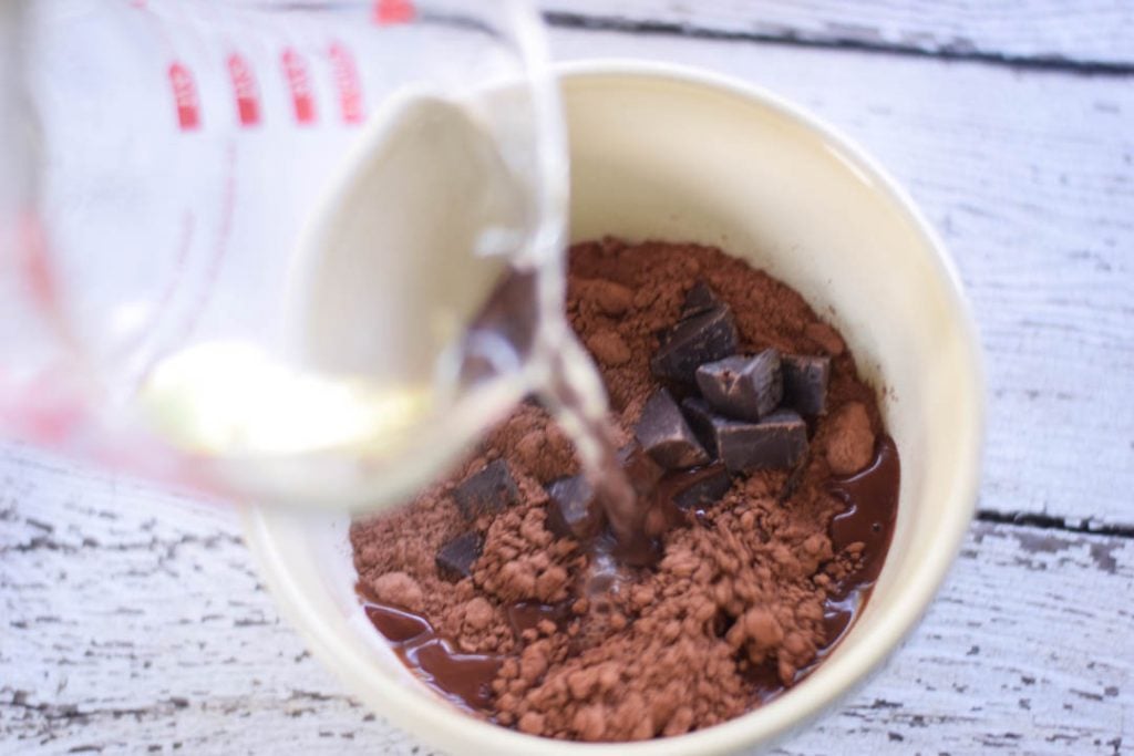 pouring hot water into cocoa mixture