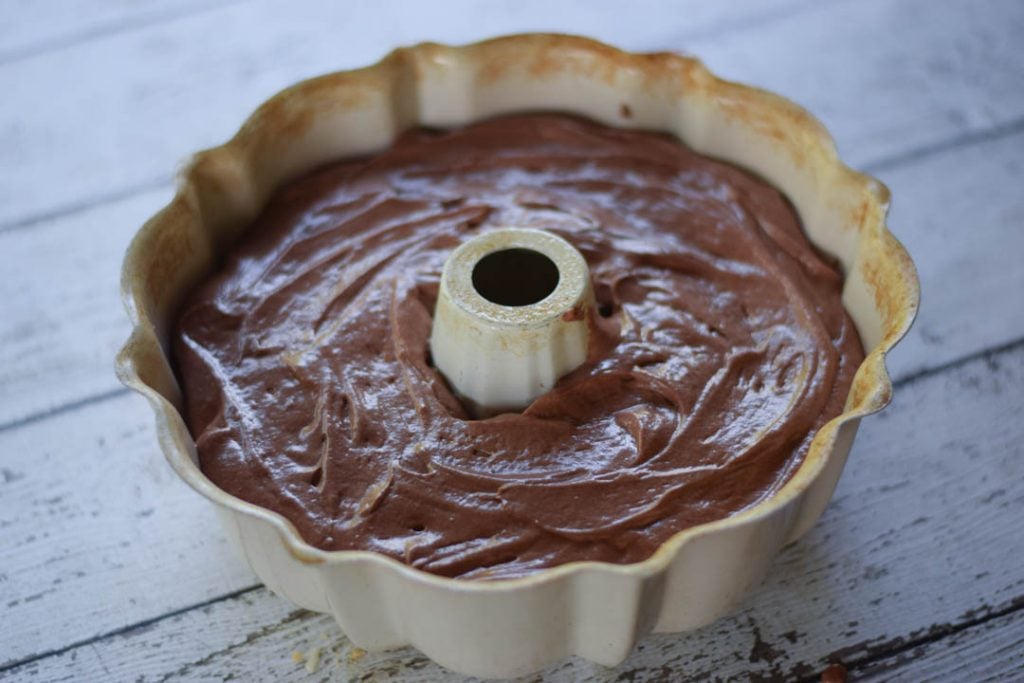 cake batter in bundt pan before baking