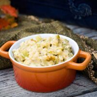 Broccoli Rice and Cheese Casserole in an orange dish