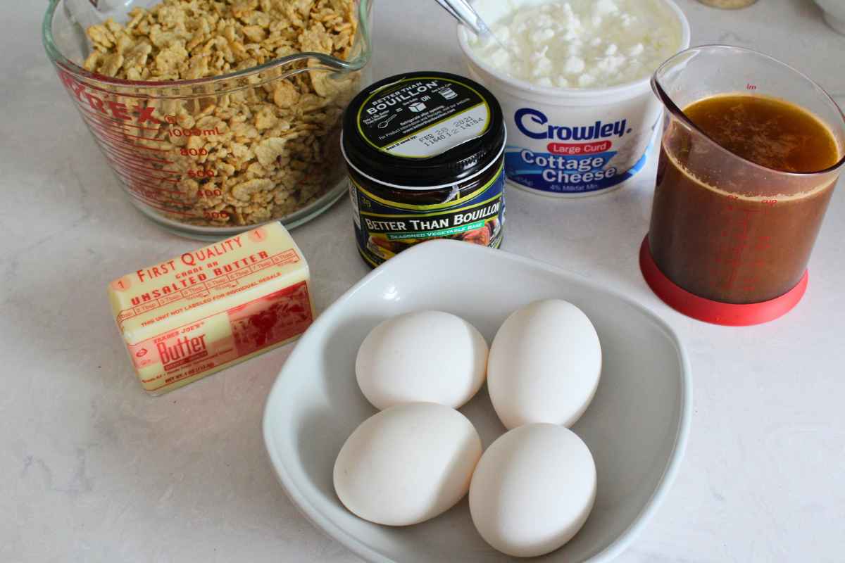 Photo of measured ingredients to include: Cereal flakes, butter, eggs, cottage cheese, and broth.