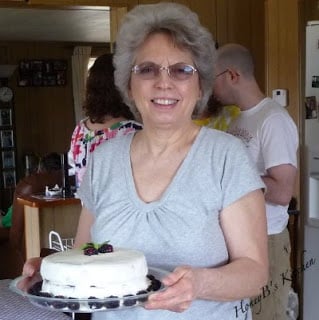 Mom holding her birthday cake