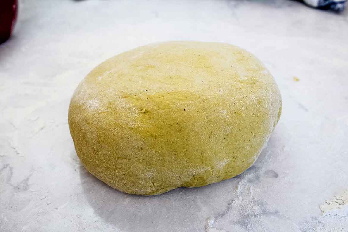 Pumpkin roll dough ready to place in a bowl to rise.