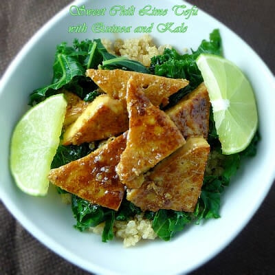 Sweet Chili Tofu on a bed of kale and quinoa with a side of fresh lime.