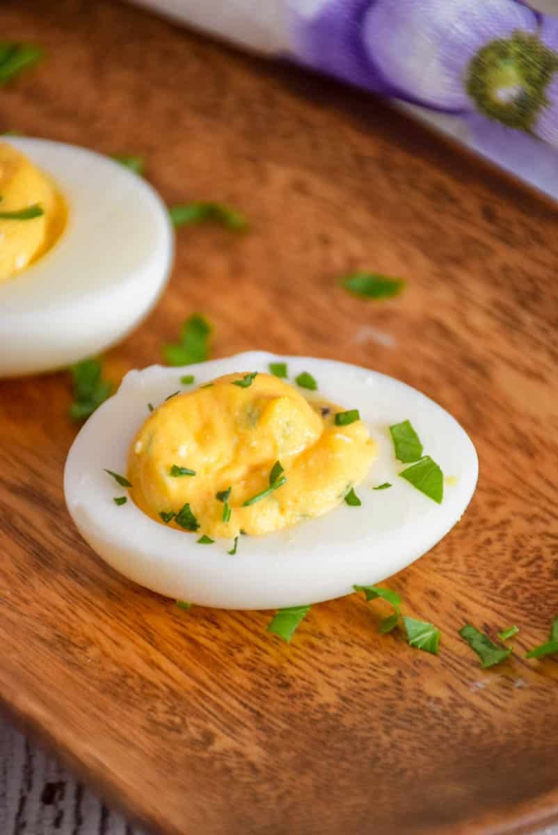 overhead shot of egg on serving tray sprinkled with parsley