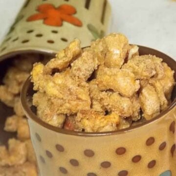 Coffee mugs filled with candied nuts.