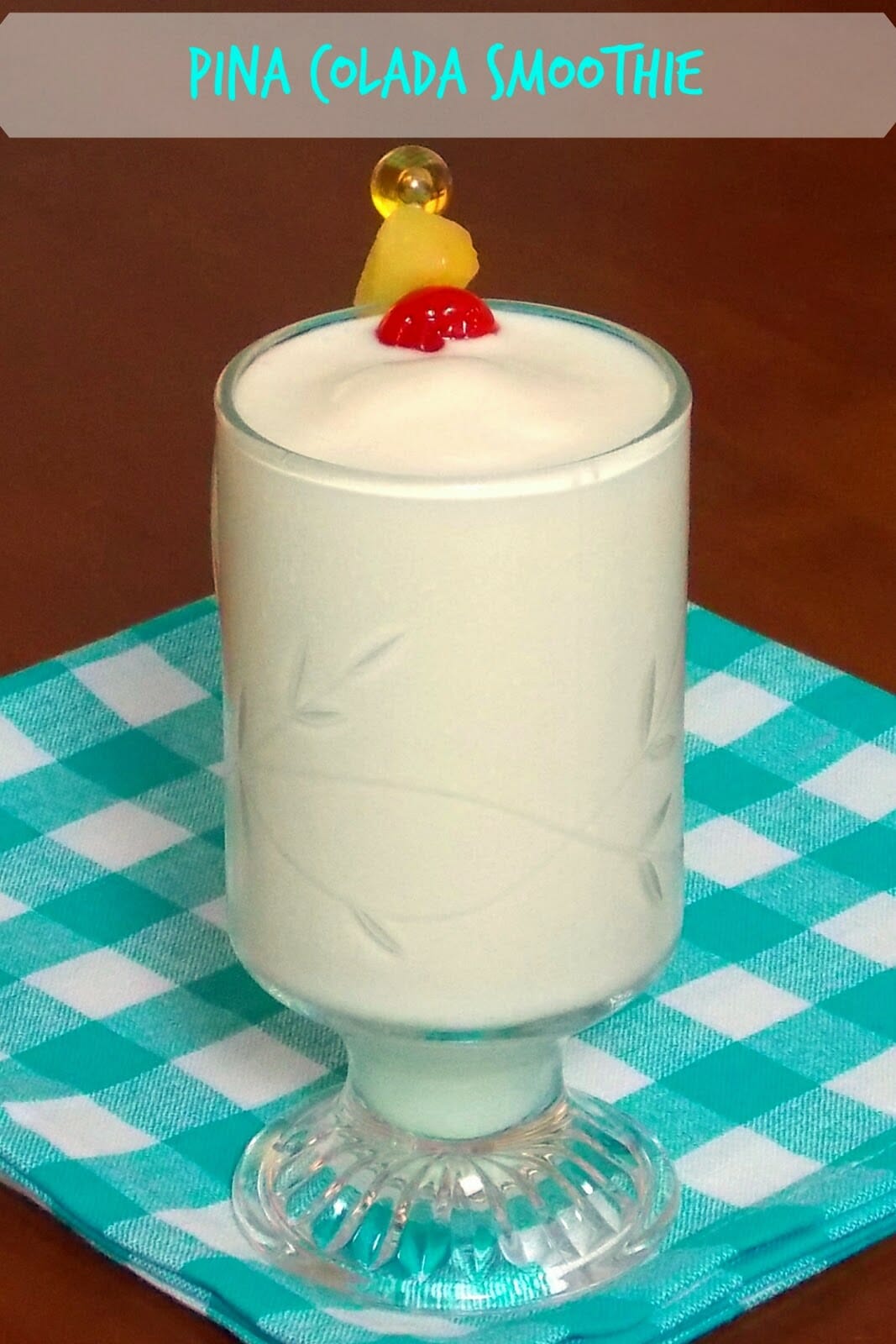 Pina Colada Smoothie with a garnish of fresh pineapple wedge and maraschino cherry.