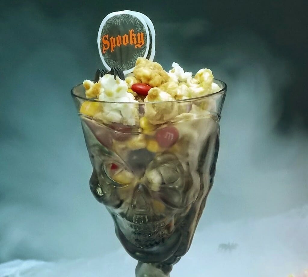 A skeleton cup full of snack mix