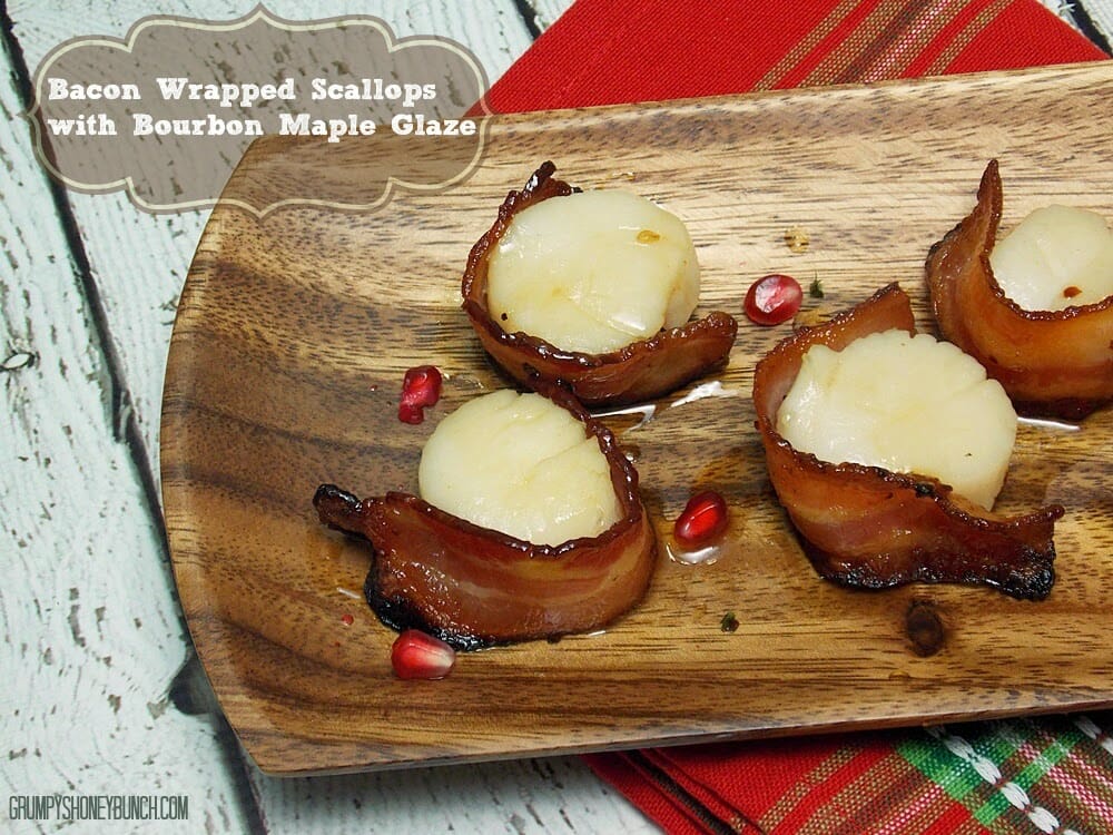 Seafood appetizers on a wooden tray.