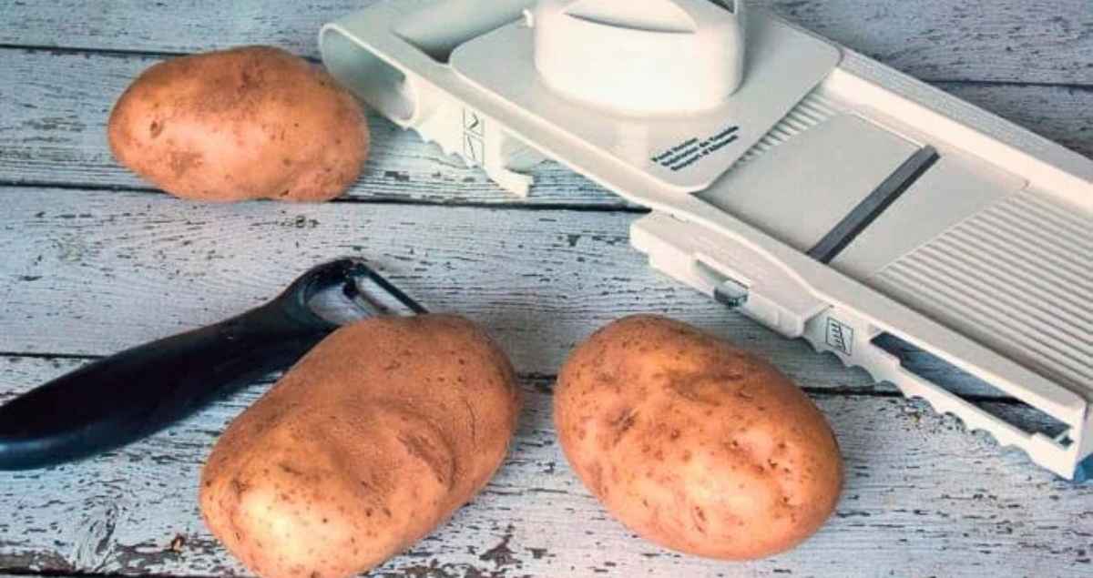 3 potatoes, a potato peeler, and mandoline.