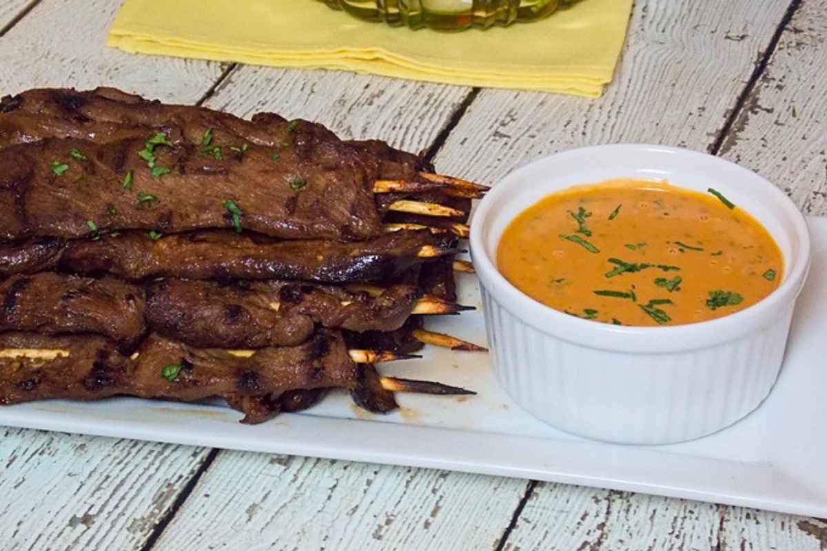 Venison Satay with a side of spicy peanut sauce.