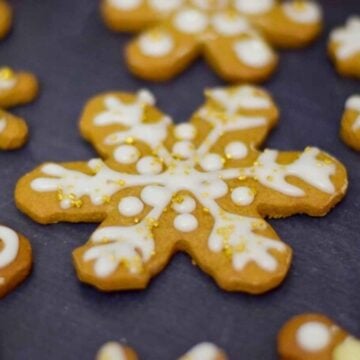 Upclose image of gingerbread snowflake cookie cutout.