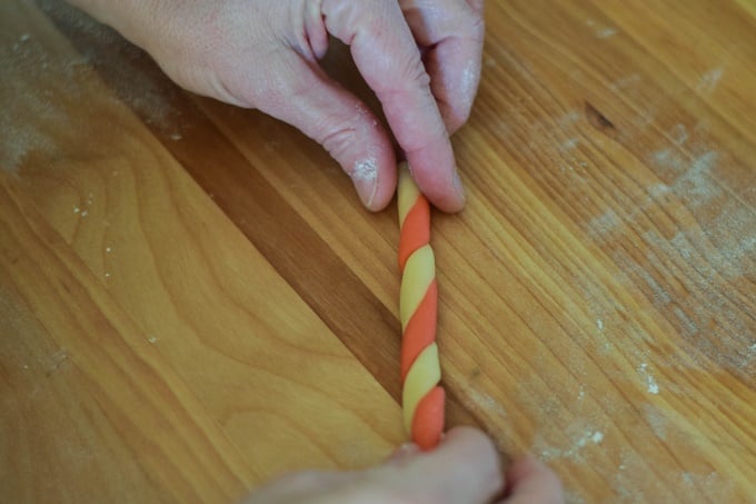 Twisting the candy cane dough ropes