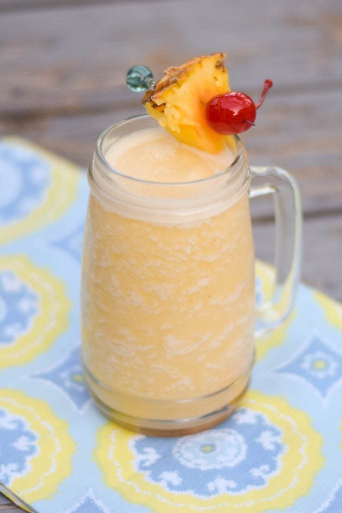 Blended Pina Colada recipe in a tall frosty glass mug.