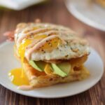 Upclose image of Asiago Waffle Egg Sandwich.