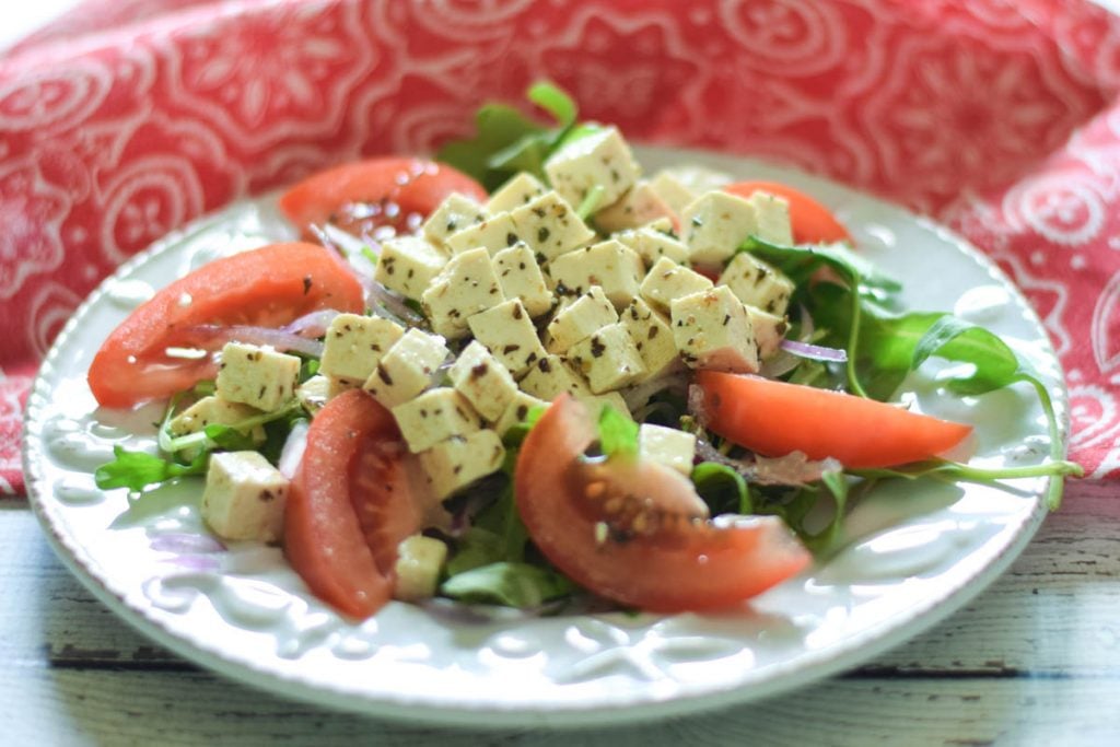 Marinated Tofu Salad Recipe on a blue plate with a red and white napkin