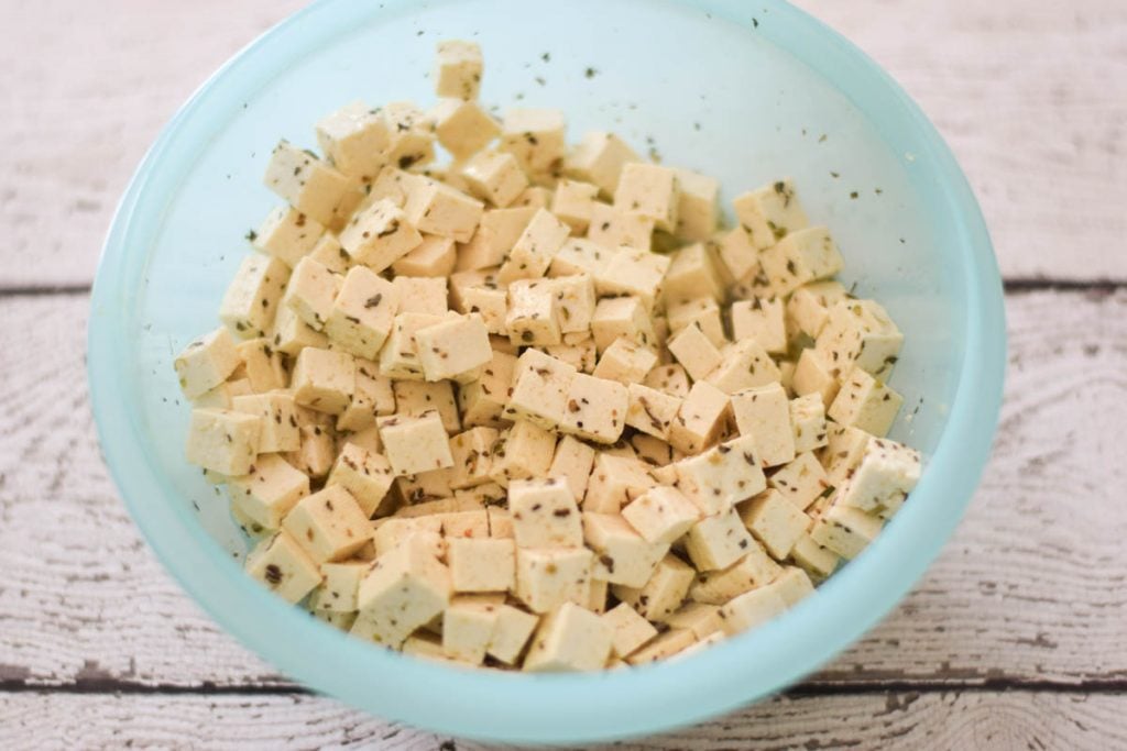 cubes of tofu soaking in the marinade