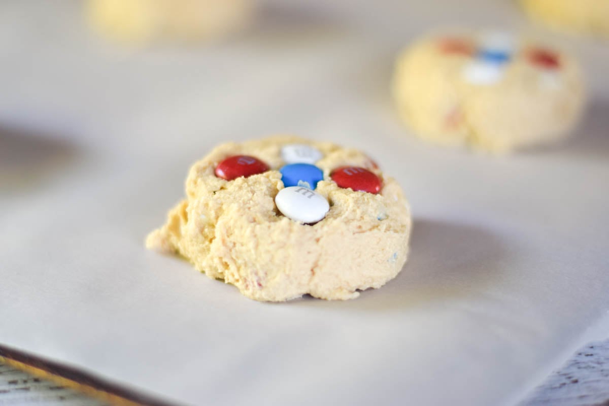 Balls of cookie dough on a baking sheet.