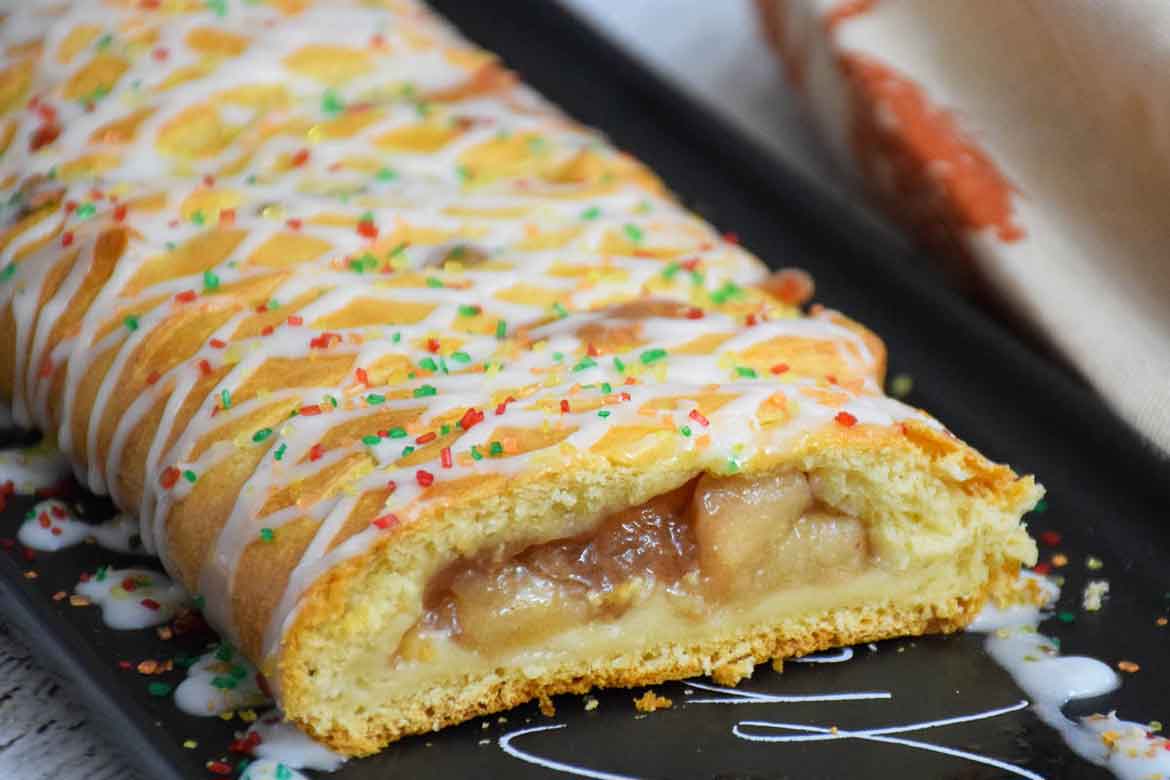 Caramel Apple Cheese Danish cut and on a black serving platter