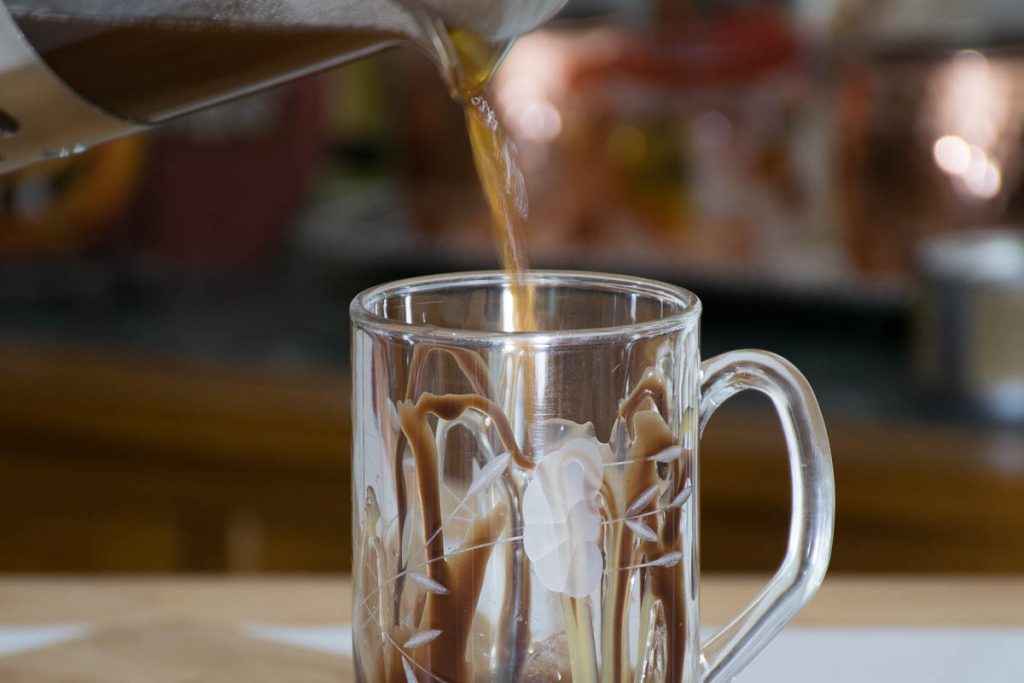 Pouring the coffee in the mug