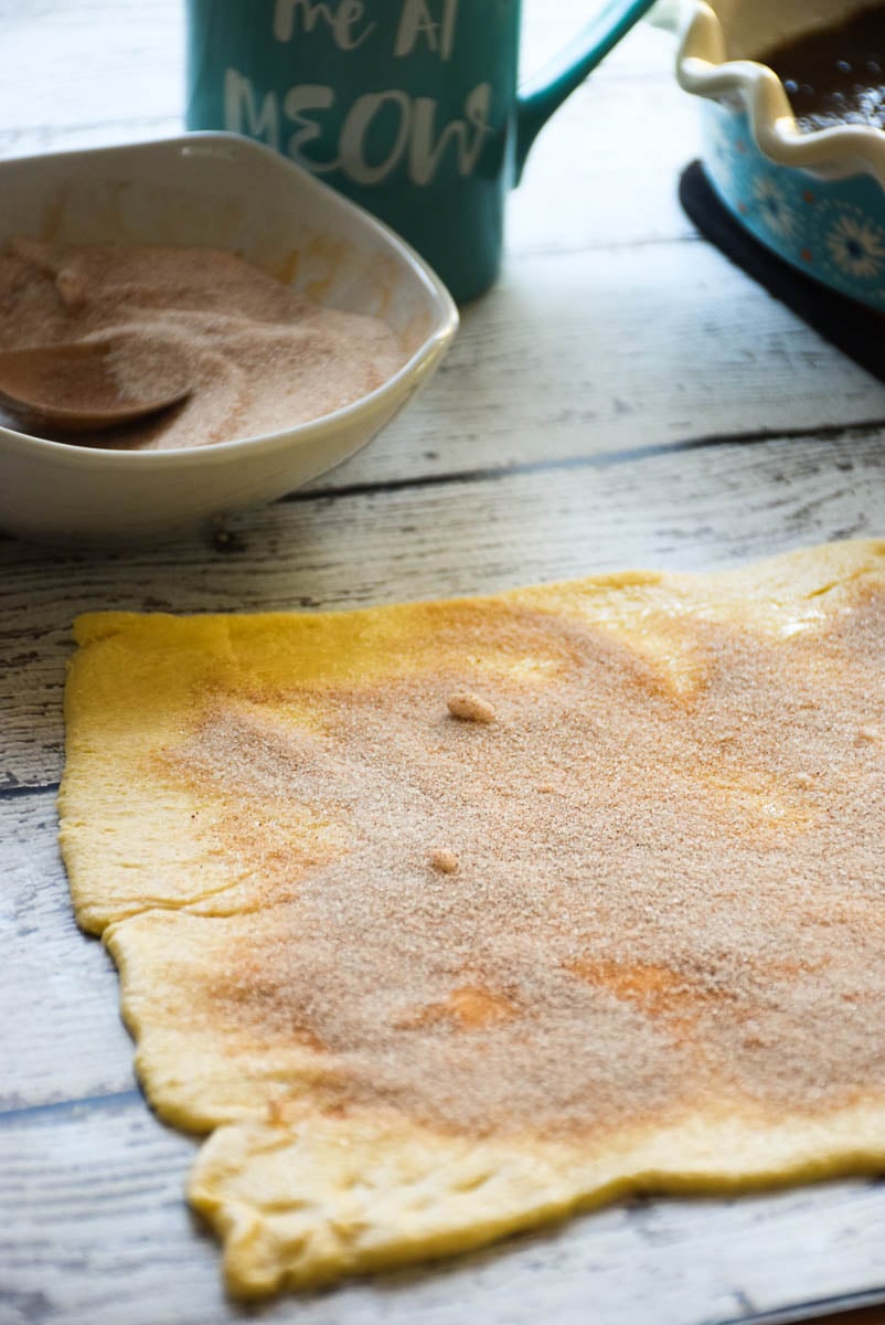 Store bought roll dough with butter, cinnamon sugar mixture sprinkled over top.