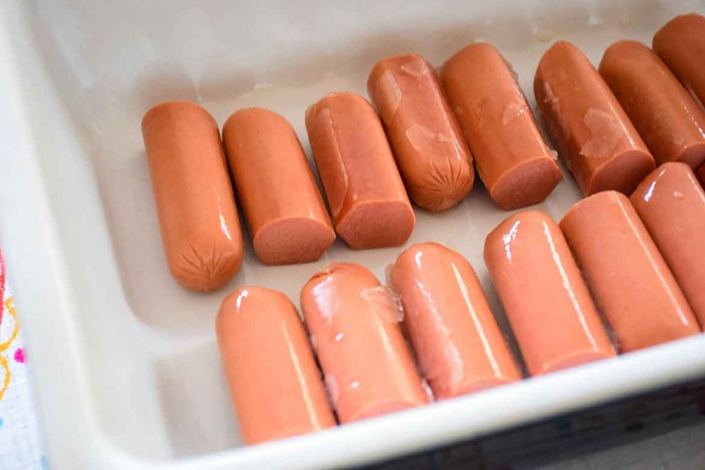 hotdogs cut in half and layered in bottom of casserole dish