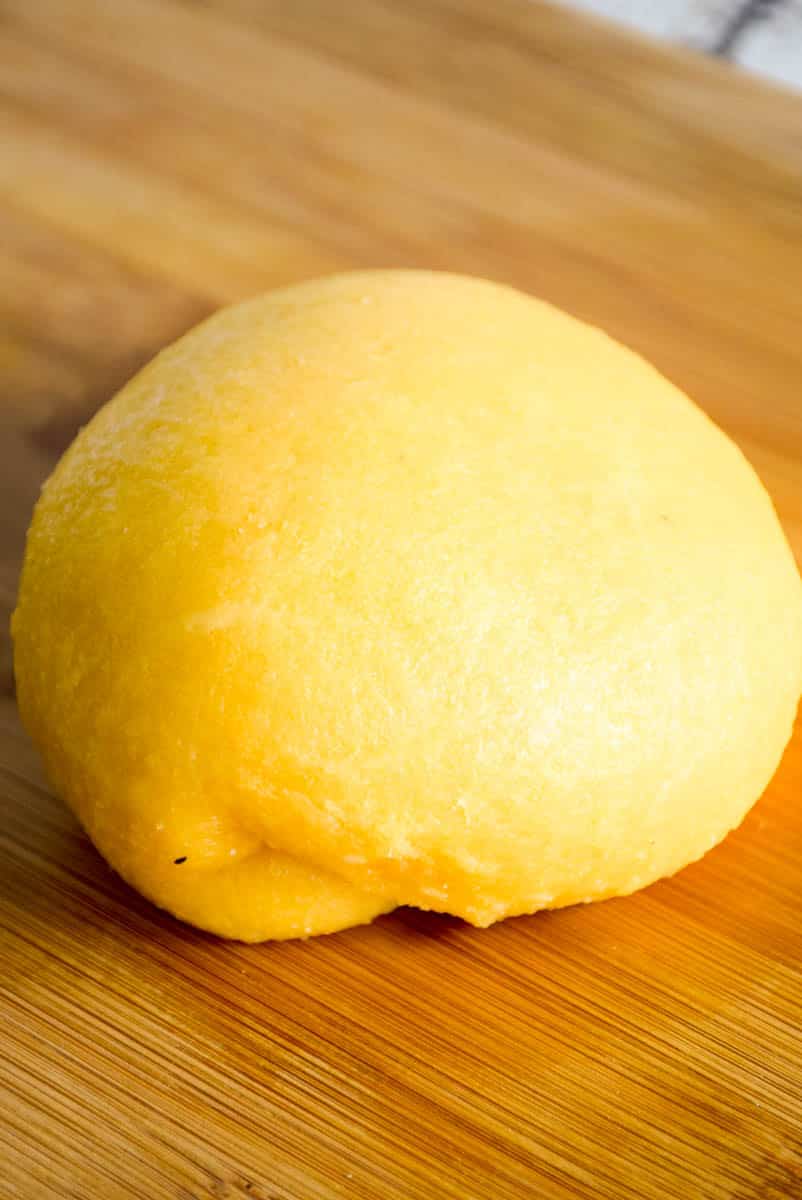 Fathead dough ball on a wooden board.