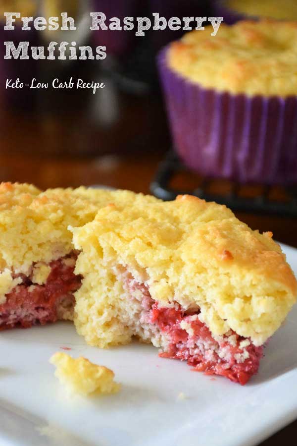 Muffin cut in half on a white plate.