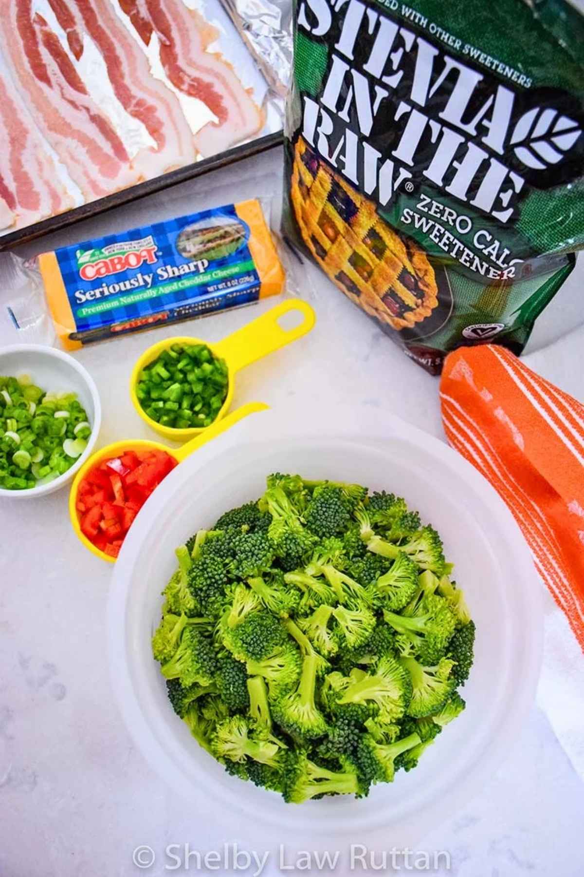 Salad ingredients: bacon, cheddar cheese, scallions, red pepper, jalapeno pepper, chopped broccoli and Stevia in the Raw.