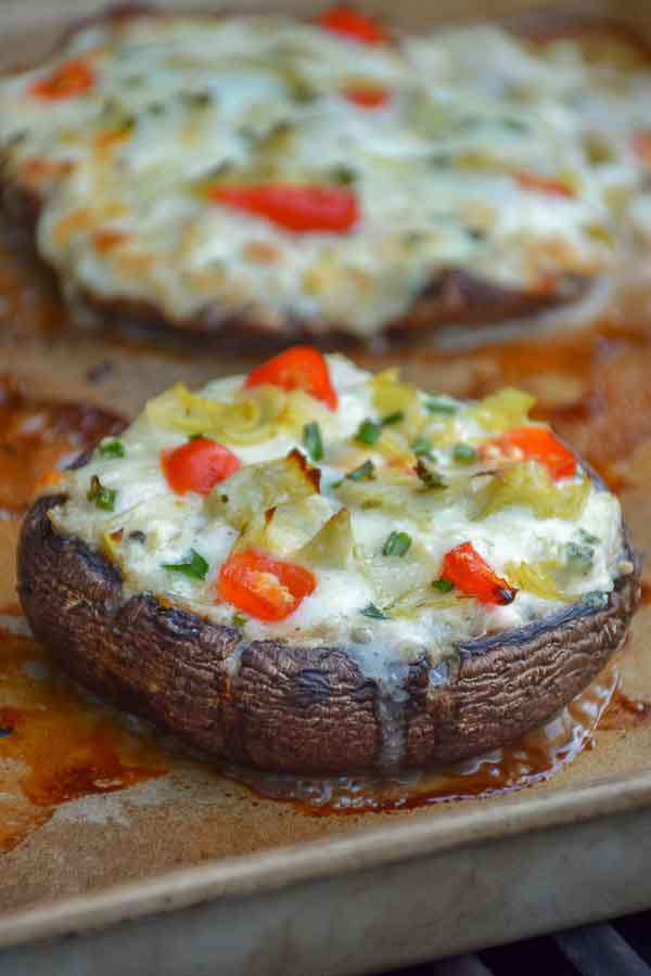 Grilled Chicken Artichoke Portobello Pizza on stoneware pan