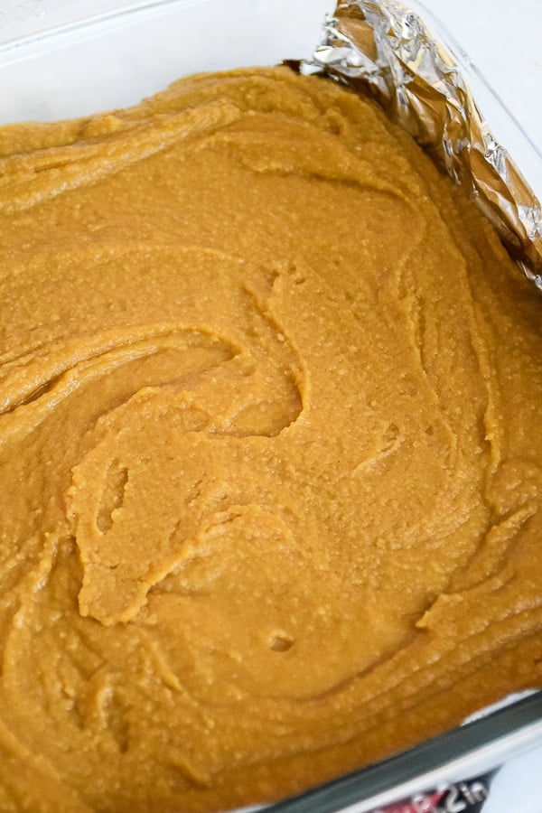 An overhead photo of fudge in the foil lined pan.