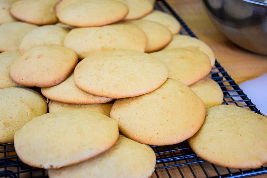 Unfrosted Sour Cream Cookies on a cooling rack.