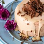 Keto Valentine Recipe Idea: Chocolate Peanut Butter Cheesecake with sugar free peanut butter sauce and chocolate shavings sprinkled on top.