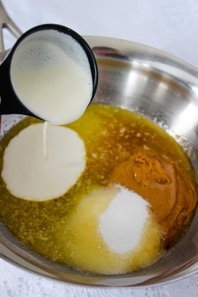 Making peanut butter sauce for chocolate peanut butter cheesecake.