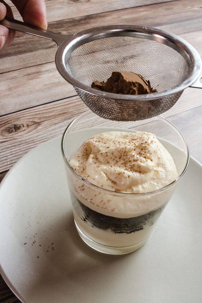 Dusting dessert with cocoa powder using with tea strainer