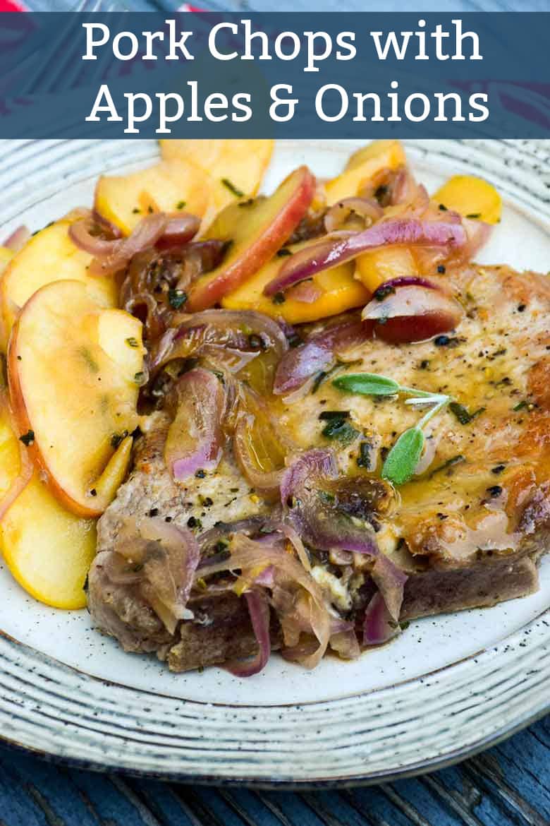 Seared pork chops with an apple onion topping on a cream plate.