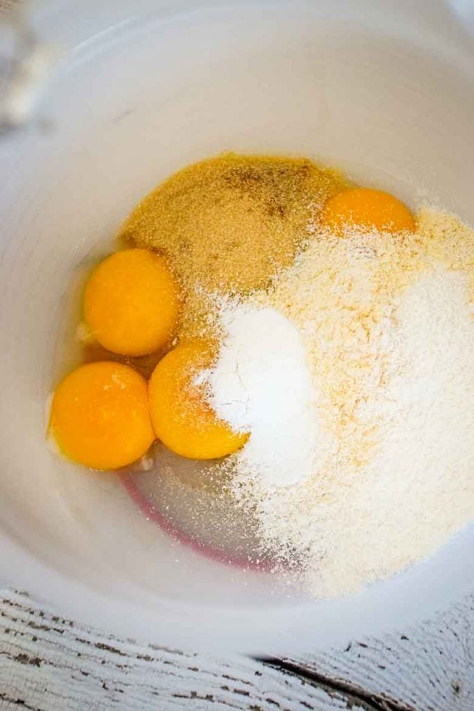 Egg yolks, coconut flour, baking powder, and sweetener in mixing bowl