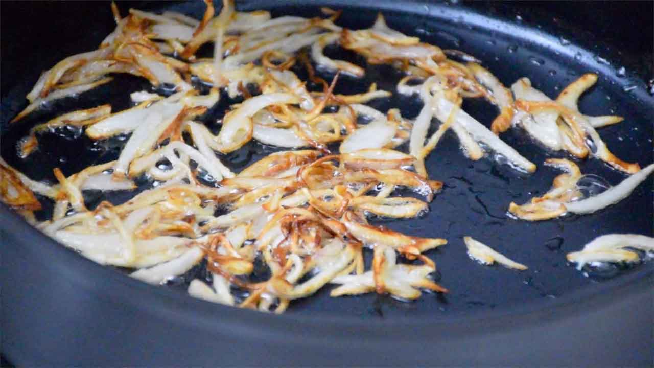 Browned Shallots frying in skillet