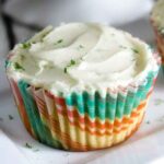 Keto coconut cupcake in a multicolored cupcake wrapper.