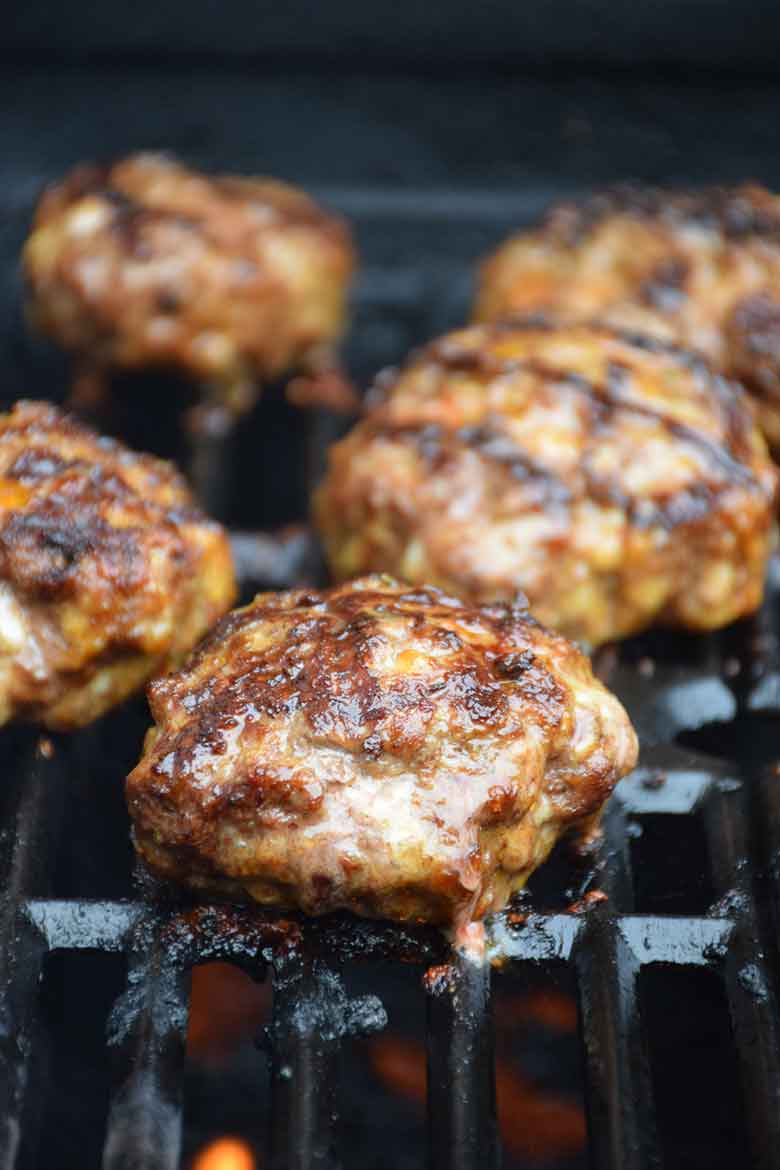 burger cooking on gas grill