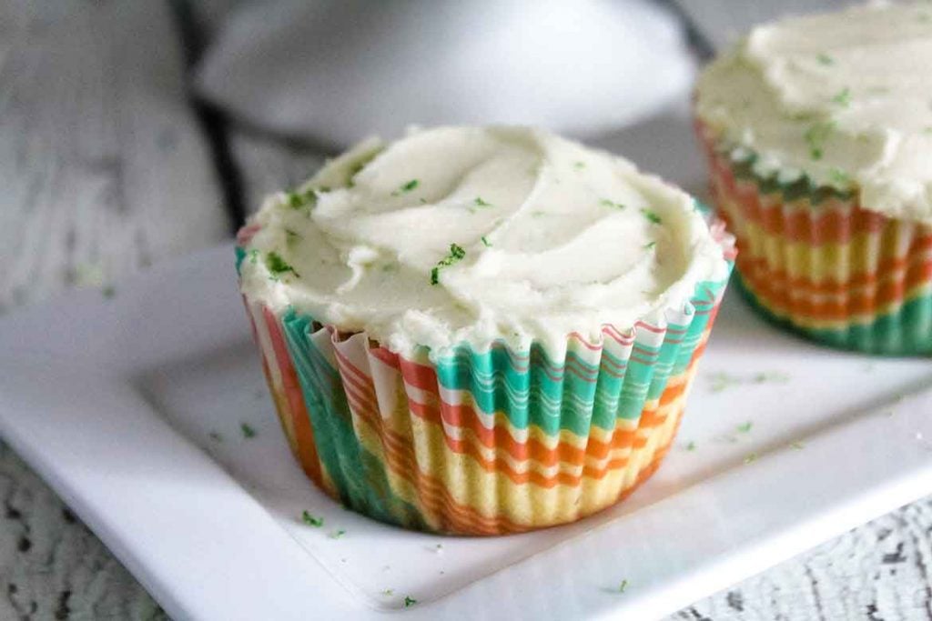 two keto coconut cupcakes on a plate