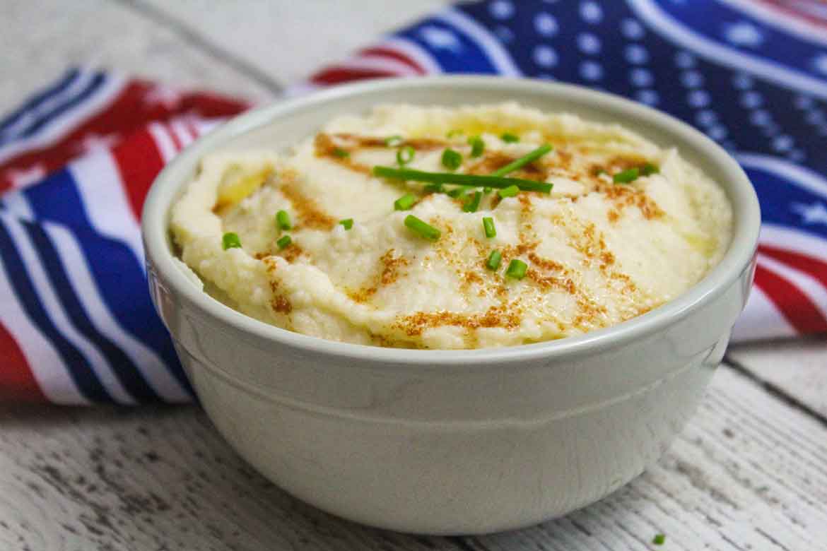 Garlic Mashed Cauliflower with Browned Butter in a serving bowl