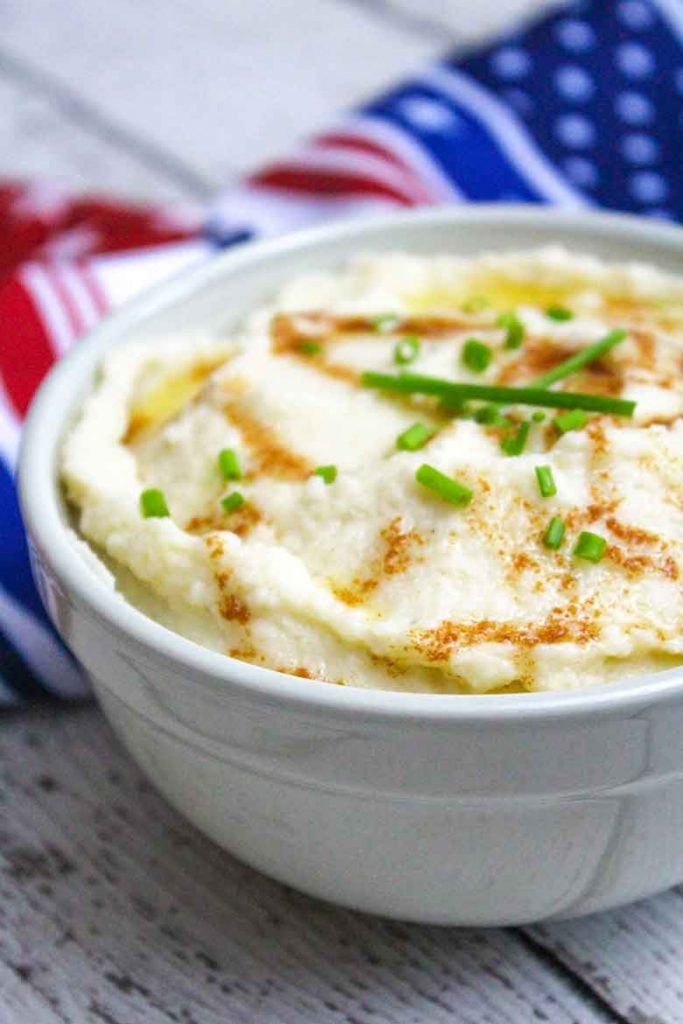 Garlic Mashed Cauliflower with Browned Butter in a serving bowl