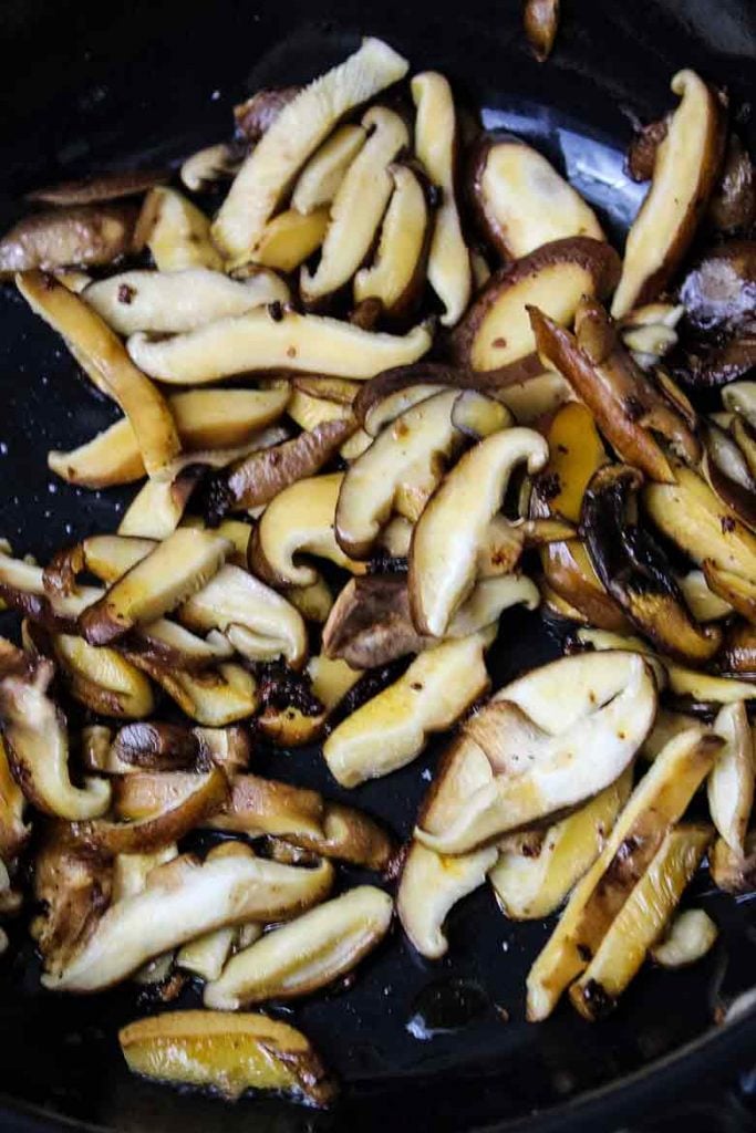 Shiitake Mushrooms frying in skillet