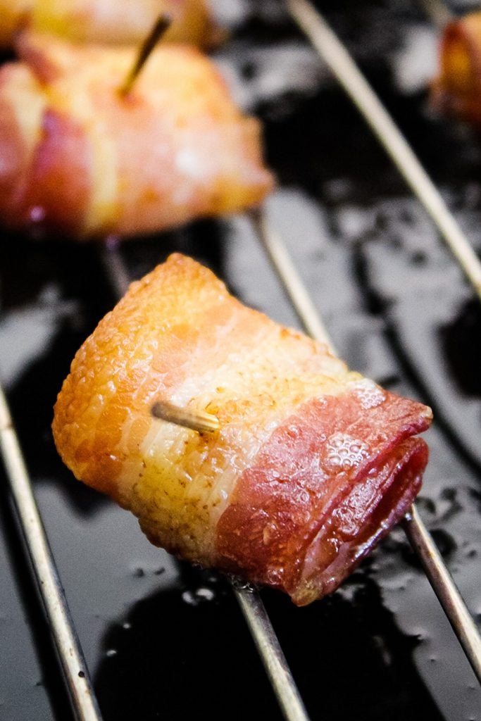 Bacon wrapped appetizer before dipping in sweet chili sauce